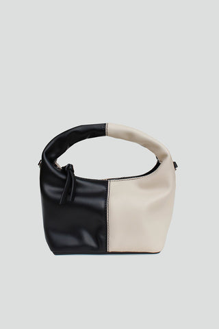 Womens color block mini crossbody bag with black faux leather and beige, featuring a zipper closure and detachable chain strap.