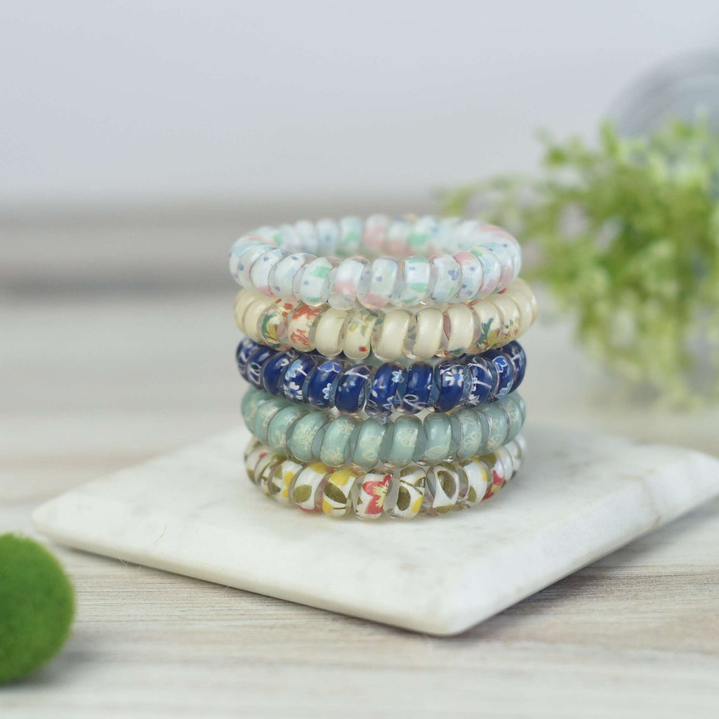 Set of 5 colorful, patterned large hair coils tied with ribbon in autumn floral design