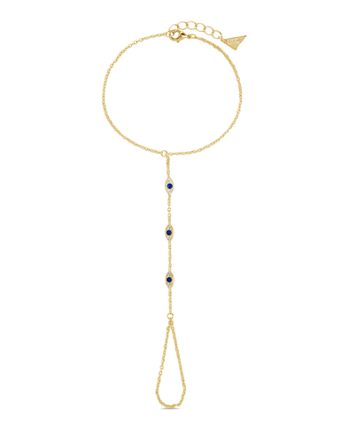 Arielle CZ Evil Eye Hand Chain in 14K gold plated brass with sapphire evil eye charms connecting fingertip to wrist