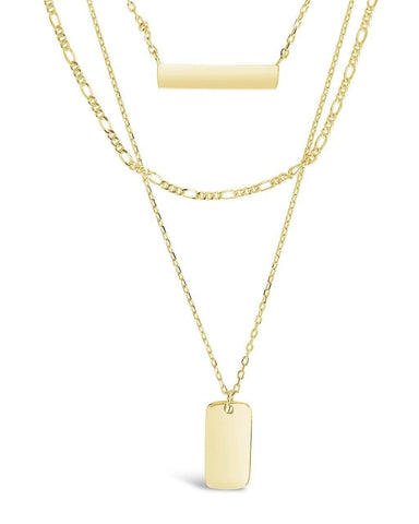 Triple layered bar necklace with vertical and horizontal bars in gold and silver tones
