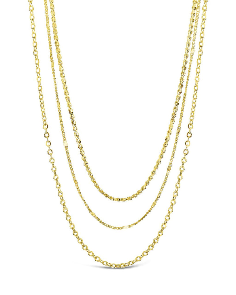 Dainty three layer chain necklace in gold and silver with delicate strands and lobster clasp