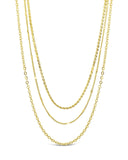 Dainty three layer chain necklace in gold and silver with delicate strands and lobster clasp