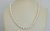 18-inch hand-knotted pearl necklace with sterling silver clasp.