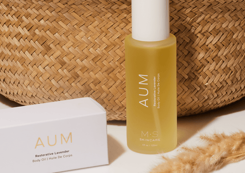 AUM Ayurvedic lavender body oil bottle with coconut oil and brightening extracts