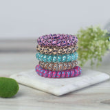 Large Lauren Lane hair coil set in mixed leopard print with no-tug, no-pull design